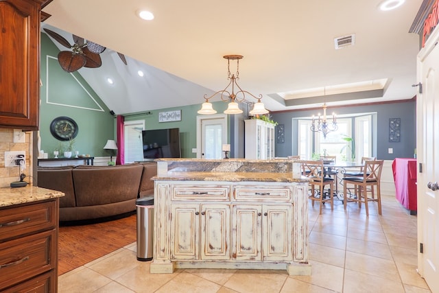 203 Murray Mccranie Rd, Norman Park, GA 31771 - kitchen featuring ceiling fan, light tile patterned floors, light stone counters, hanging light fixtures, and recessed lighting