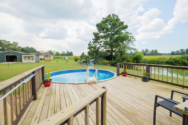 203 Murray Mccranie Rd, Norman Park, GA 31771 - outdoor pool featuring a wooden deck, a yard, and an outdoor structure