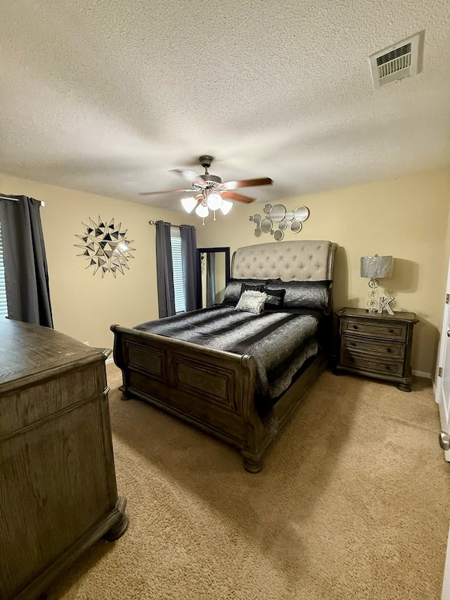 3650 Tupelo Rd, Valdosta, GA 31605 - bedroom featuring light colored carpet, a textured ceiling, and a ceiling fan