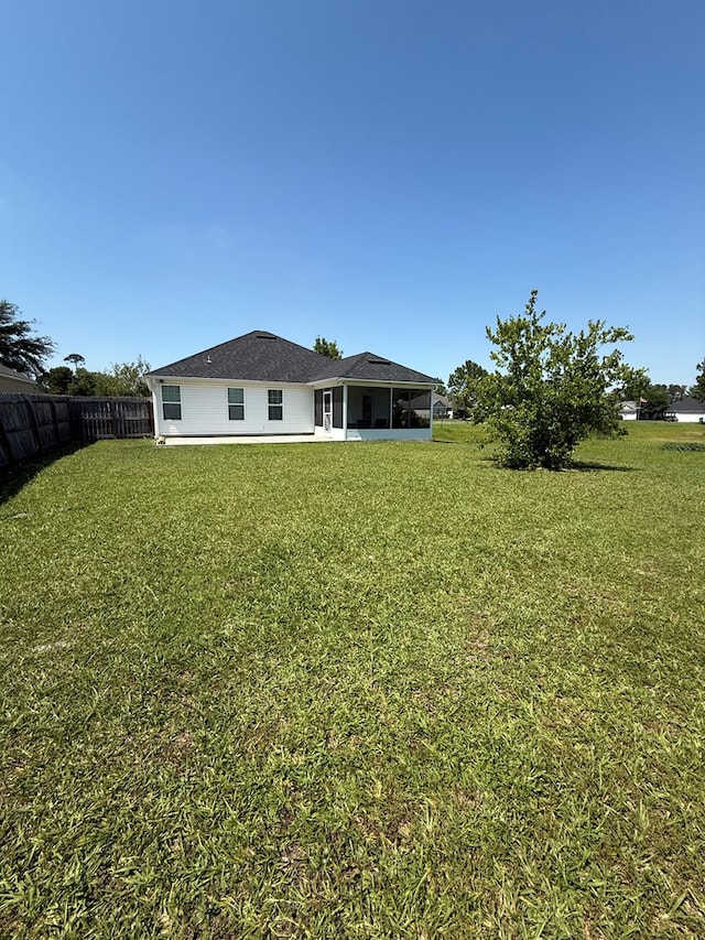 3650 Tupelo Rd, Valdosta, GA 31605 - rear view of house with a sunroom