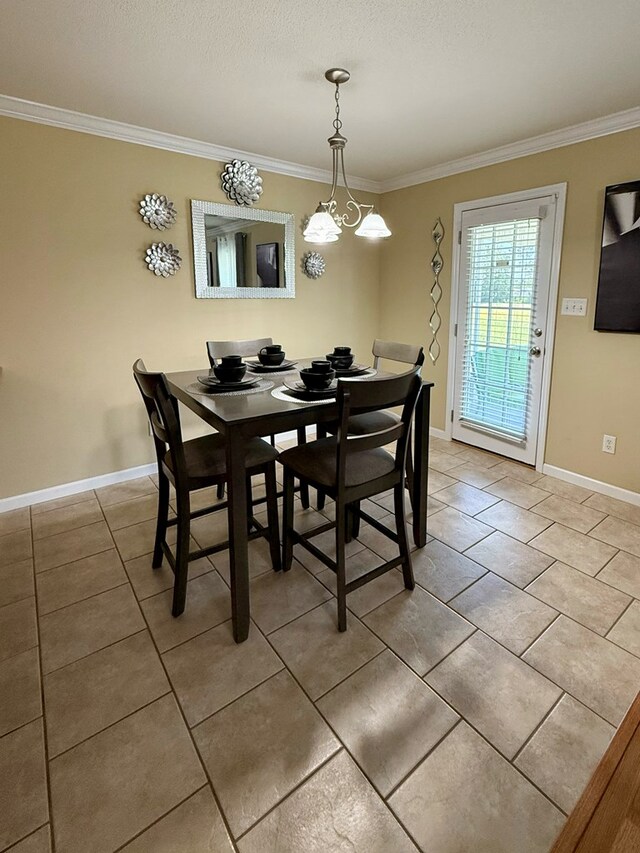 3650 Tupelo Rd, Valdosta, GA 31605 - dining room featuring light tile patterned flooring, ornamental molding, and baseboards