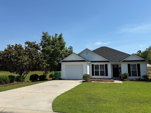 3650 Tupelo Rd, Valdosta, GA 31605 - view of front of property with driveway, a front yard, an attached garage, and a shingled roof