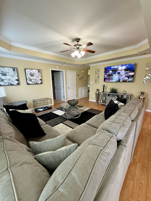 3650 Tupelo Rd, Valdosta, GA 31605 - living room with wood finished floors, ornamental molding, a ceiling fan, and baseboards