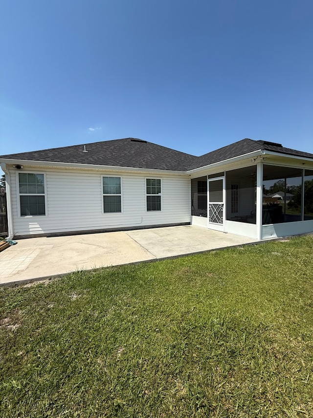 3650 Tupelo Rd, Valdosta, GA 31605 - rear view of property featuring a sunroom, a patio area, and a lawn