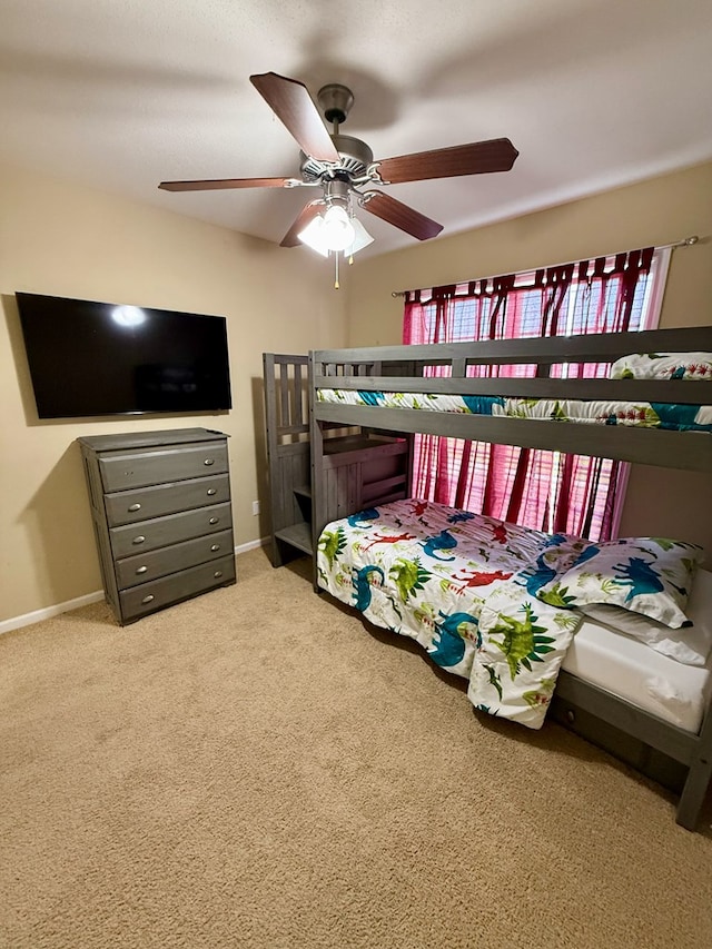 3650 Tupelo Rd, Valdosta, GA 31605 - bedroom with carpet, a ceiling fan, and baseboards