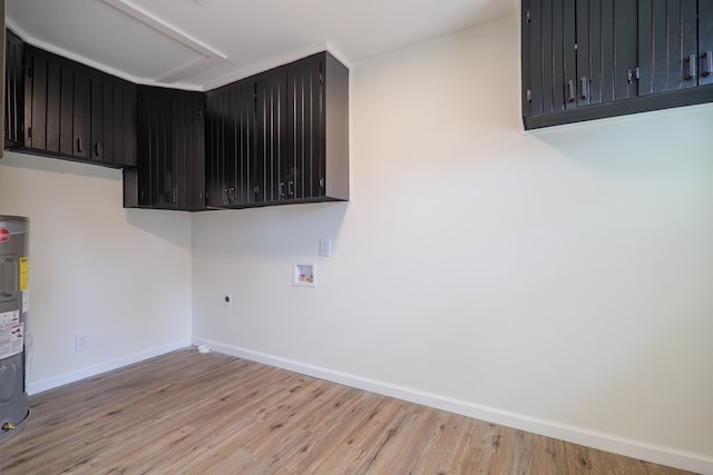 6041 NE Edmundson Rd, Hahira, GA 31632 - laundry area featuring baseboards, light wood finished floors, hookup for a washing machine, electric dryer hookup, and electric water heater