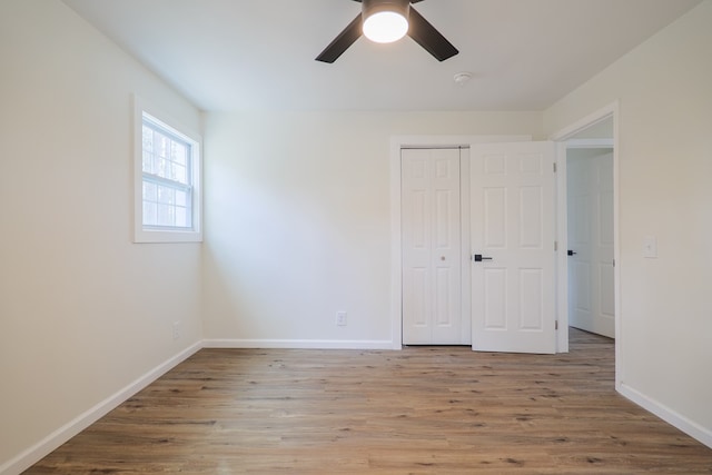 6041 NE Edmundson Rd, Hahira, GA 31632 - unfurnished bedroom featuring wood finished floors, baseboards, and a closet
