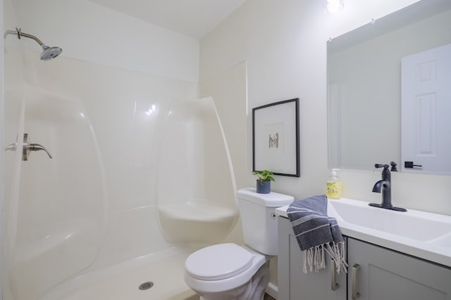 6041 NE Edmundson Rd, Hahira, GA 31632 - bathroom with toilet, vanity, and a shower