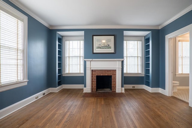 unfurnished living room with a wealth of natural light and dark hardwood / wood-style flooring