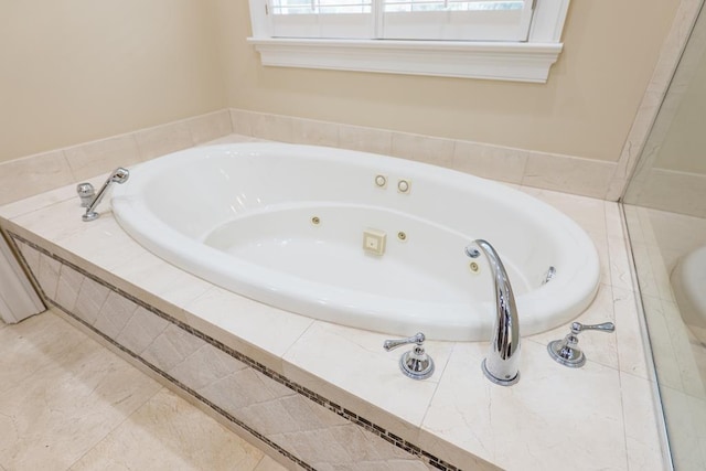 bathroom with tiled tub