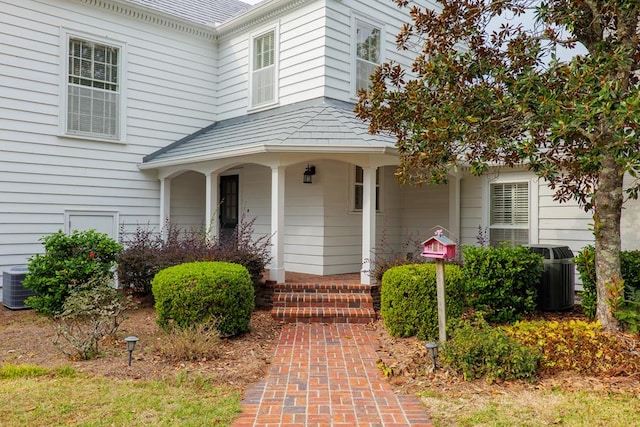 doorway to property featuring central AC