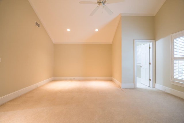 bonus room featuring light colored carpet and vaulted ceiling