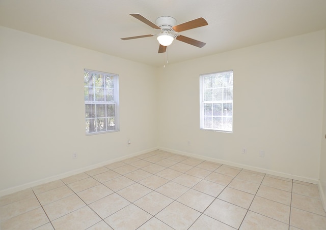 unfurnished room featuring light tile patterned floors and ceiling fan