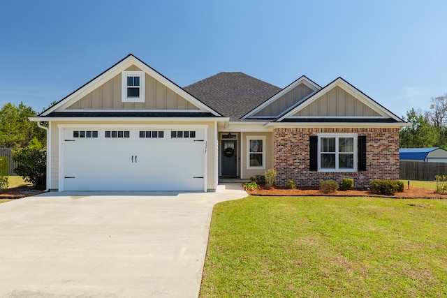 view of front of home featuring brick siding, an attached garage, board and batten siding, a front yard, and driveway