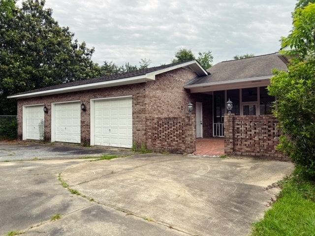 ranch-style home featuring a garage