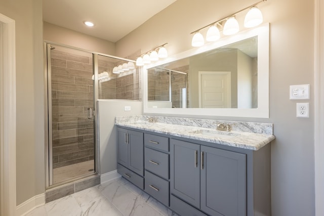 bathroom featuring vanity and a shower with shower door