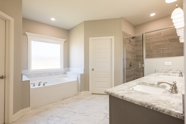 bathroom featuring vanity and shower with separate bathtub