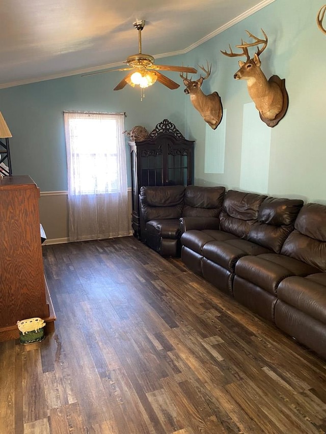 living room with crown molding, ceiling fan, and dark hardwood / wood-style flooring