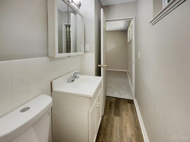 824 Cascade Rd, Forest Park, OH 45240 - bathroom featuring wood finished floors, vanity, and toilet