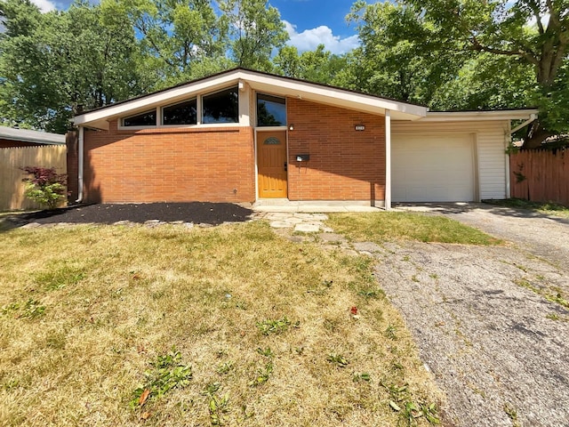 824 Cascade Rd, Forest Park, OH 45240 - mid-century home with driveway, a garage, and brick siding