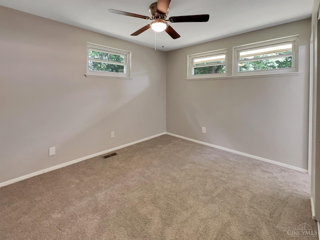 824 Cascade Rd, Forest Park, OH 45240 - unfurnished room featuring carpet, baseboards, and a ceiling fan
