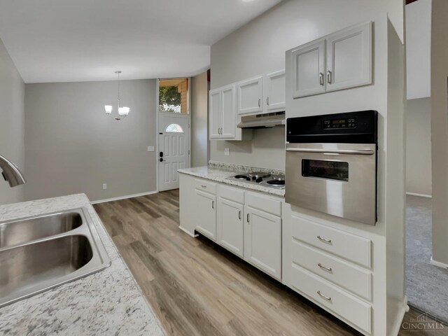 824 Cascade Rd, Forest Park, OH 45240 - kitchen with wall oven, a sink, under cabinet range hood, wood finished floors, and stovetop