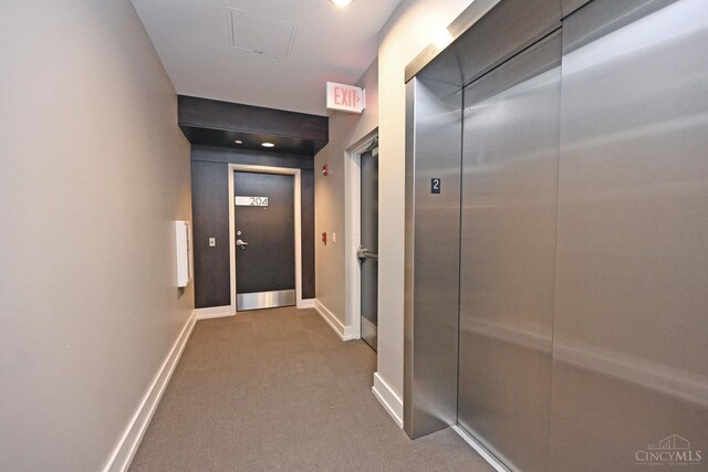 1 Mercer St Unit 204, Cincinnati, OH 45202 - corridor with baseboards, carpet floors, and elevator