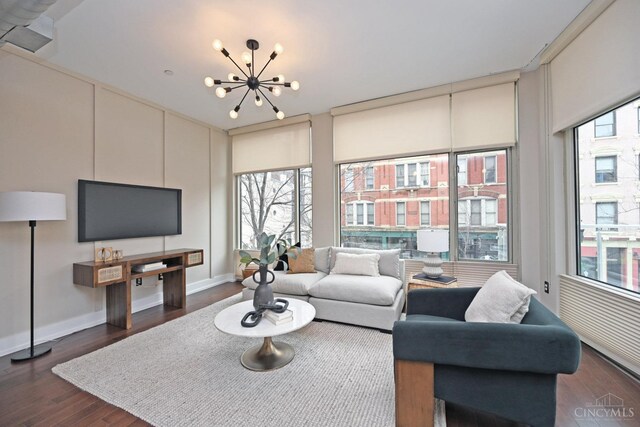 1 Mercer St Unit 204, Cincinnati, OH 45202 - living area featuring an inviting chandelier, dark wood finished floors, and baseboards