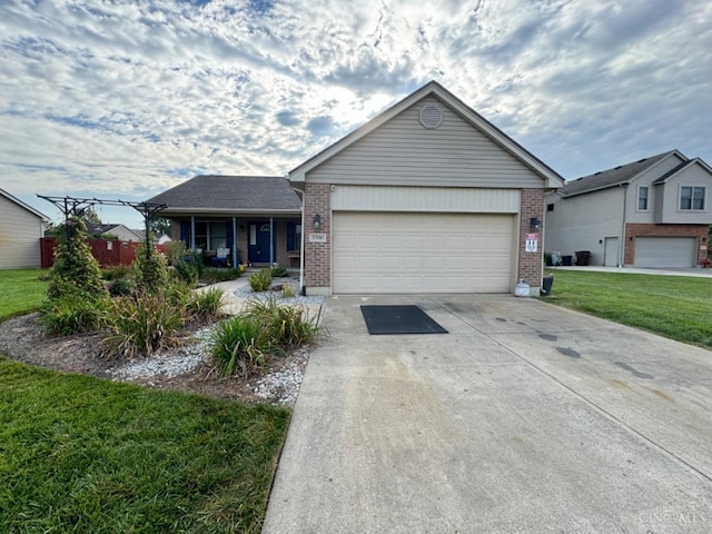 single story home with a garage and a front yard