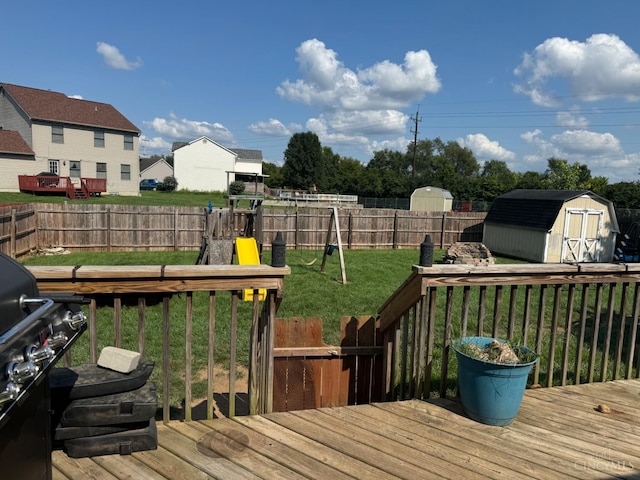 5506 Glen Ct, Carlisle, OH 45005 - deck with area for grilling, a lawn, and a storage unit
