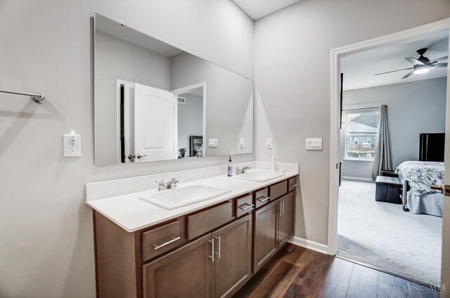 61 Goldfish Ln, Pierce Twp, OH 45102 - bathroom with double vanity, wood finished floors, a ceiling fan, and baseboards