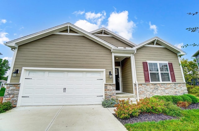 61 Goldfish Ln, Pierce Twp, OH 45102 - craftsman-style house featuring stone siding, a garage, and driveway