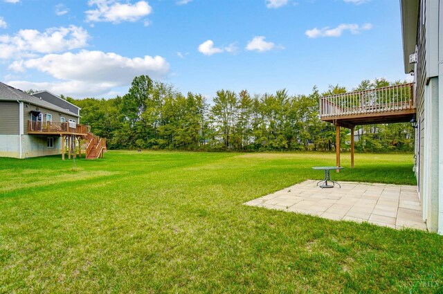 61 Goldfish Ln, Pierce Twp, OH 45102 - view of green lawn with a patio, stairway, and a wooden deck