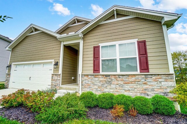 61 Goldfish Ln, Pierce Twp, OH 45102 - craftsman inspired home with stone siding, an attached garage, and concrete driveway