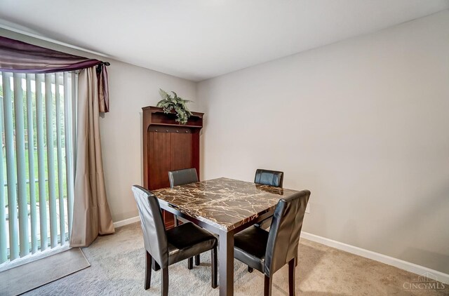 61 Goldfish Ln, Pierce Twp, OH 45102 - dining area with light carpet and baseboards