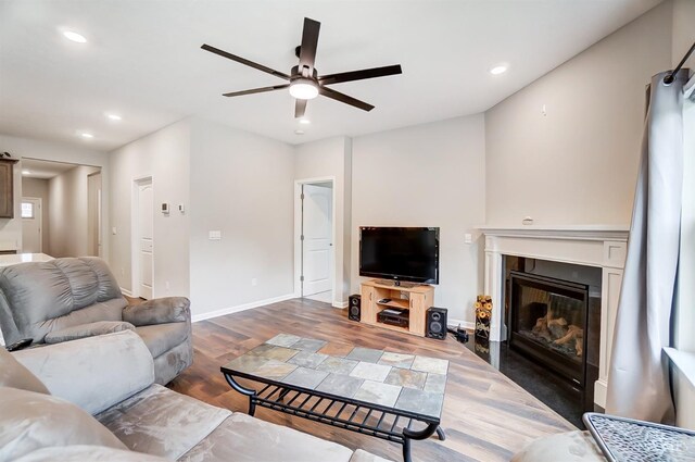 61 Goldfish Ln, Pierce Twp, OH 45102 - living room with a ceiling fan, recessed lighting, a glass covered fireplace, wood finished floors, and baseboards