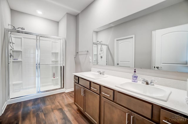 61 Goldfish Ln, Pierce Twp, OH 45102 - full bathroom with a shower stall, wood finished floors, double vanity, and baseboards