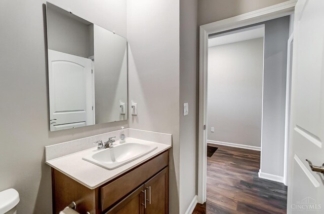 61 Goldfish Ln, Pierce Twp, OH 45102 - bathroom with vanity, wood finished floors, toilet, and baseboards
