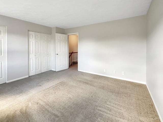 unfurnished bedroom with carpet