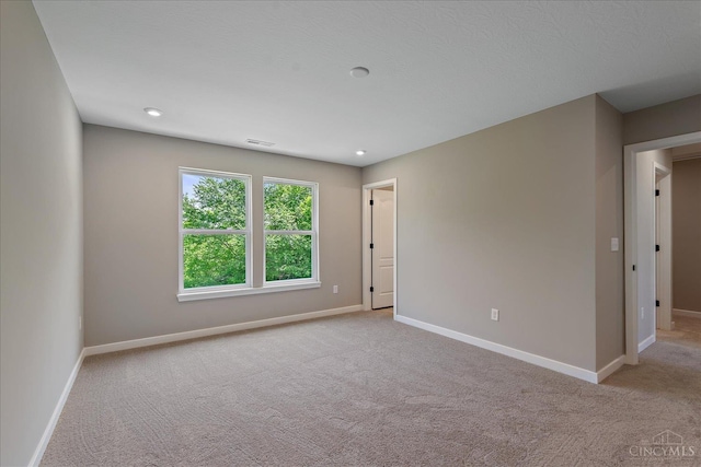 1658 Whitewater Trails Blvd, Harrison, OH 45030 - spare room featuring carpet flooring, baseboards, and recessed lighting