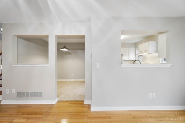 818 William Howard Taft Rd, Cincinnati, OH 45206 - empty room with stairway and light wood finished floors