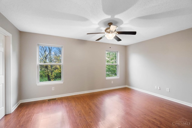 818 William Howard Taft Rd, Cincinnati, OH 45206 - spare room with wood finished floors, ceiling fan, and a textured ceiling