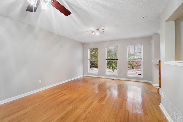 818 William Howard Taft Rd, Cincinnati, OH 45206 - unfurnished room featuring light wood-type flooring, a ceiling fan, and a textured ceiling