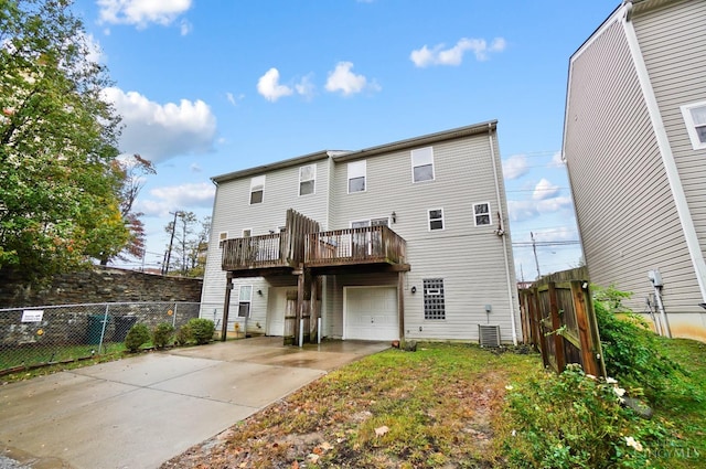 818 William Howard Taft Rd, Cincinnati, OH 45206 - rear view of house with a garage and concrete driveway