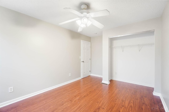 818 William Howard Taft Rd, Cincinnati, OH 45206 - unfurnished bedroom with a closet, wood finished floors, and a ceiling fan