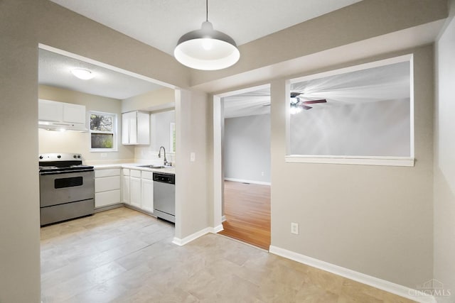818 William Howard Taft Rd, Cincinnati, OH 45206 - kitchen with appliances with stainless steel finishes, under cabinet range hood, white cabinets, light countertops, and a ceiling fan