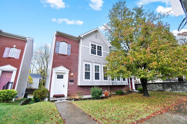 818 William Howard Taft Rd, Cincinnati, OH 45206 - view of front of house with brick siding and a front lawn