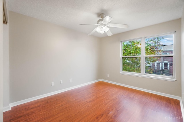 818 William Howard Taft Rd, Cincinnati, OH 45206 - unfurnished room with wood finished floors, ceiling fan, and a textured ceiling