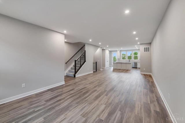 7230 Abington Way Unit 21805, West Chester, OH 45069 - unfurnished living room featuring wood finished floors, recessed lighting, and stairway