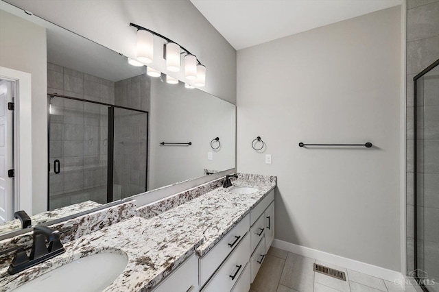 7230 Abington Way Unit 21805, West Chester, OH 45069 - full bath with double vanity, a stall shower, and tile patterned floors